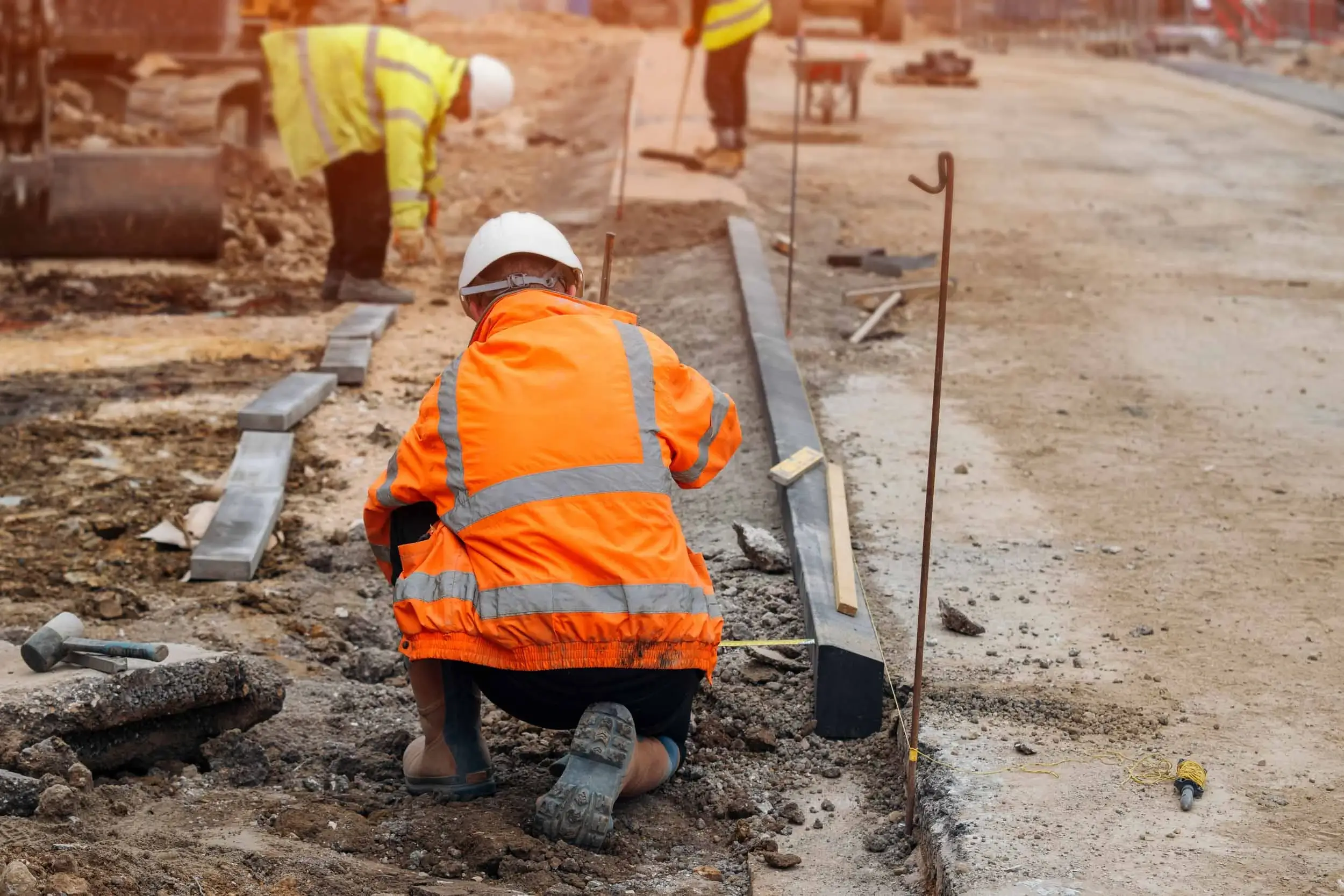 Construction worker on a construction site wearing a hi vis jacket