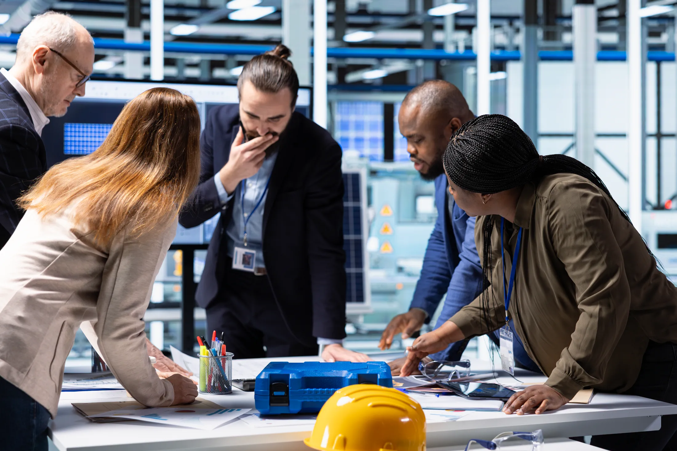 Professionals collaborating on a technical project and developing workplace skills